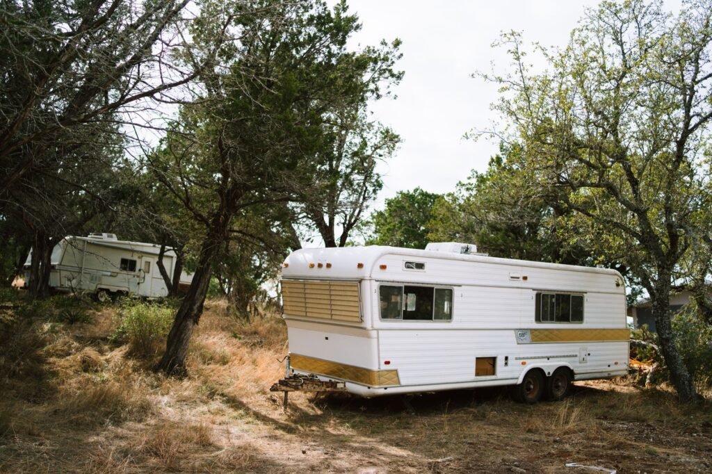 A 2026 electric travel trailer at a solar charging station with a towing EV. practical detail
