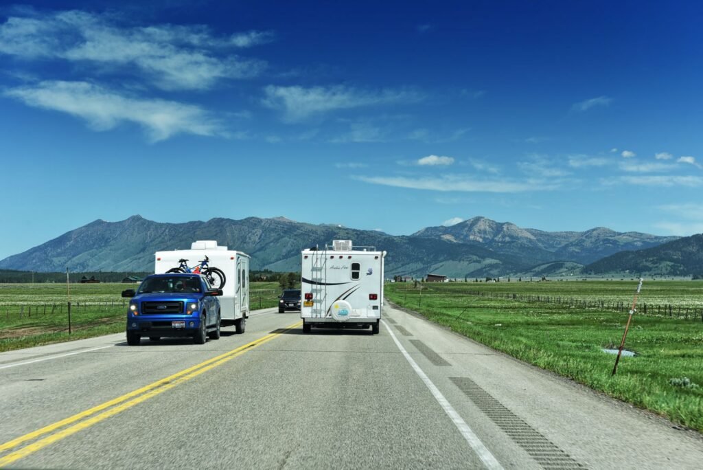 A 2026 luxury fifth wheel RV parked in a scenic mountain location at sunset. practical detail