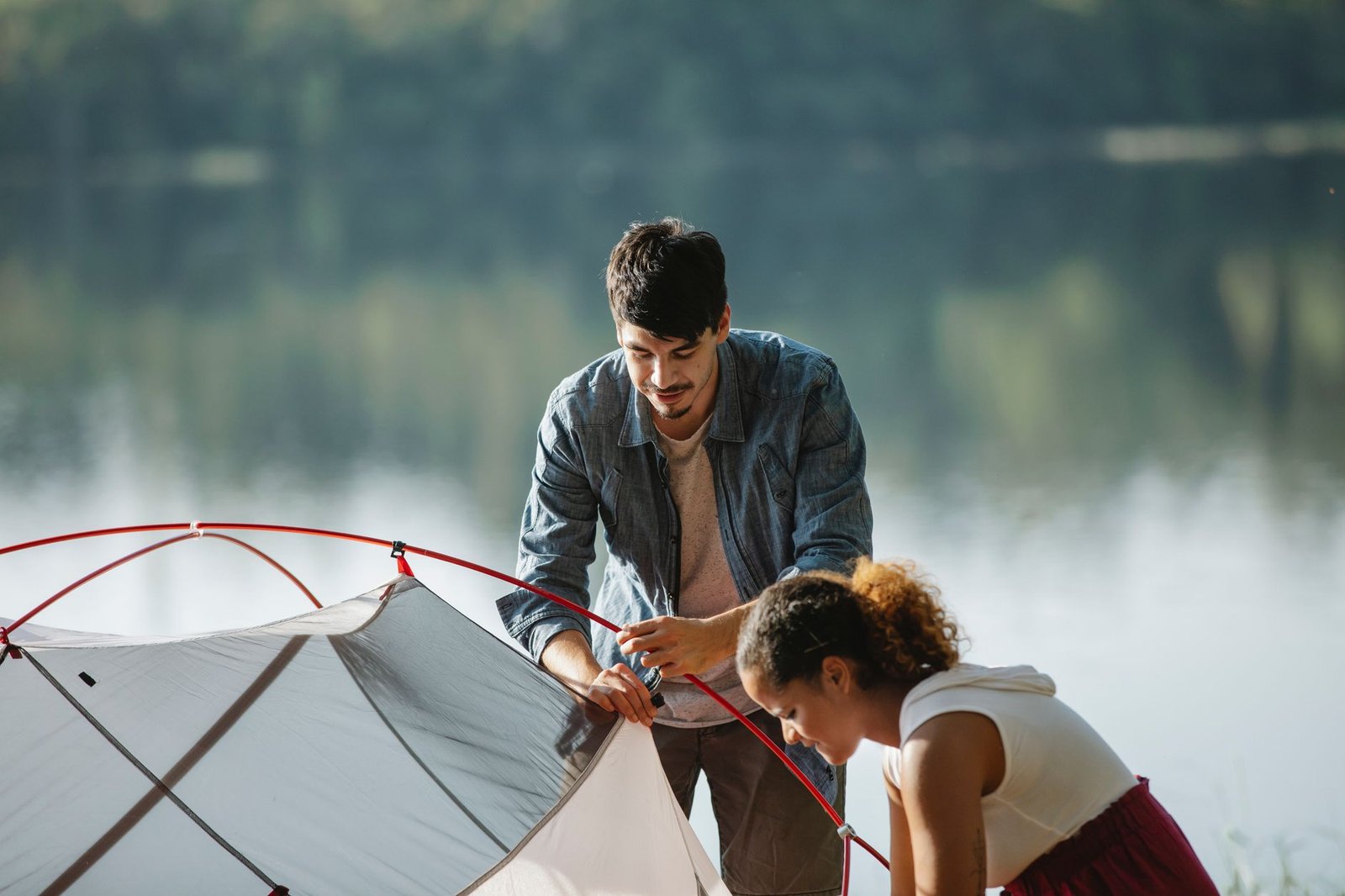 Tax-free camping gear including a portable generator, cooler, and tools set up next to an RV in Florida