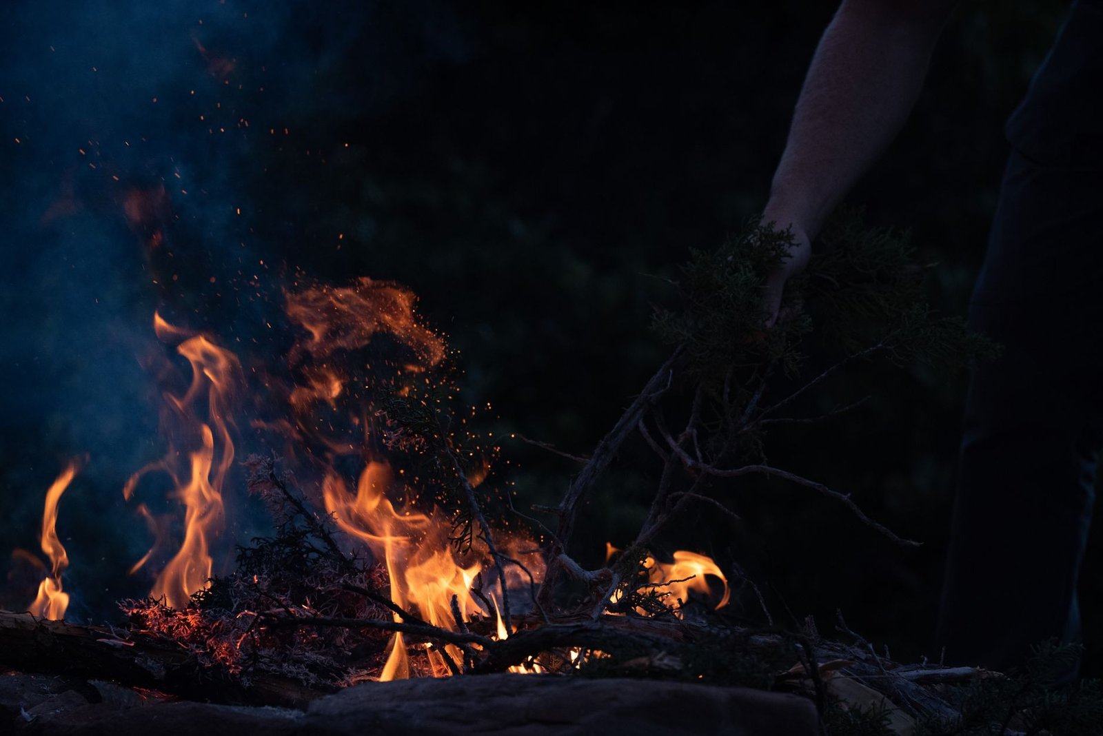 Travel trailer camped safely in a National Forest under campfire restrictions using a portable propane fire bowl.