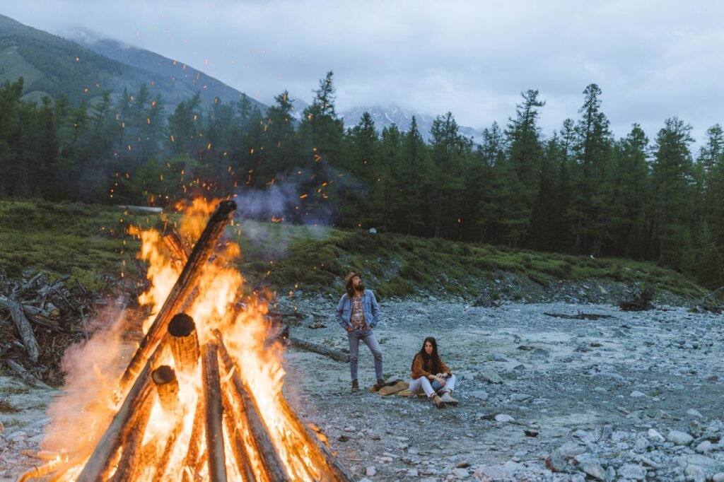 Travel trailer camped safely in a National Forest under campfire restrictions using a portable propane fire bowl. practical detail