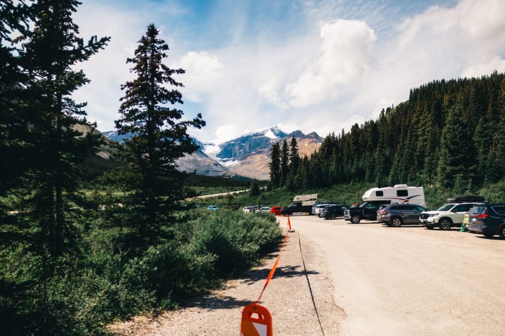National Park campground sign showing RV size restrictions with a travel trailer in the background. practical detail
